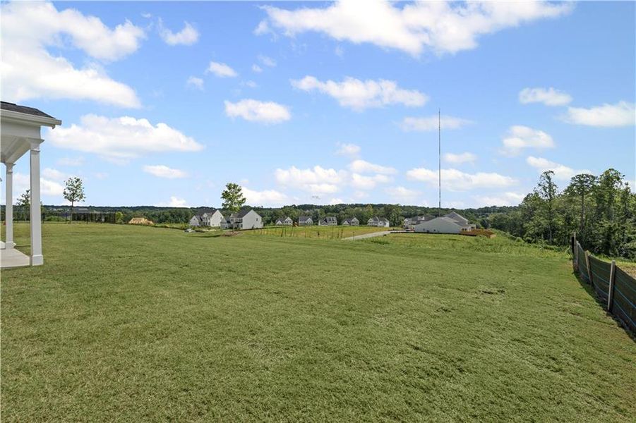 Front exterior of a new home in Reunion, Flowery Branch, GA, highlighting curb appeal (Image 1). Front exterior of a new home in Reunion, Flowery Branch, GA, highlighting curb appeal (Image 1).