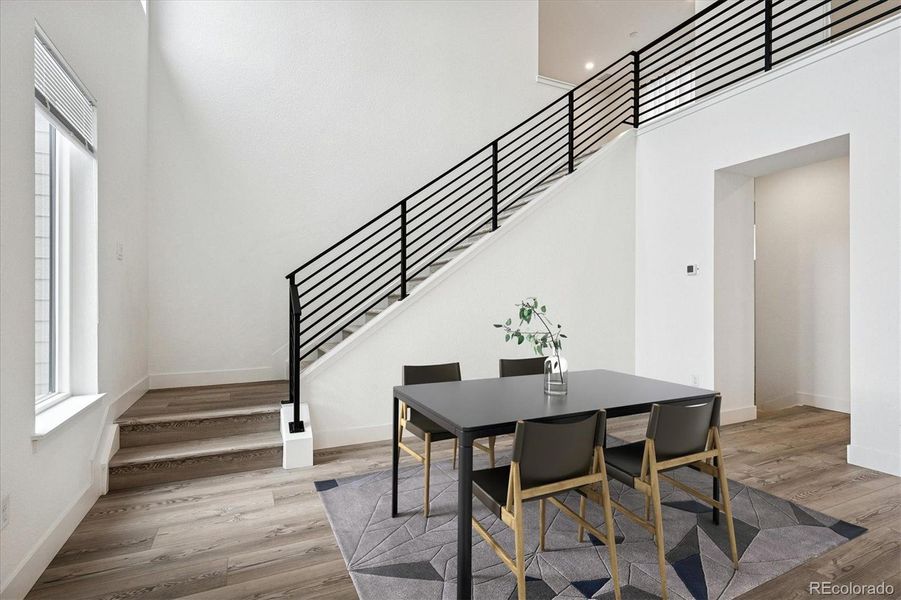 Virtually staged dining area w/vaulted ceiling Virtually staged dining area w/vaulted ceiling