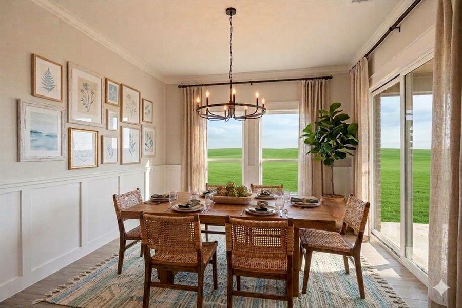 Dining space featuring a decorative wall, wood finished floors, wainscoting, hanging lights, and view of golf course
