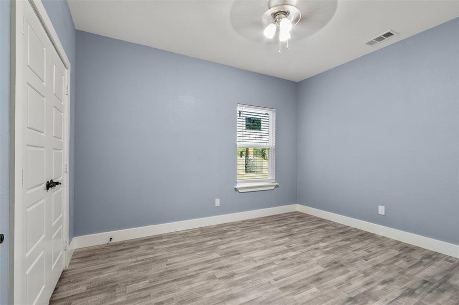 Unfurnished bedroom featuring light hardwood / wood-style flooring and ceiling fan