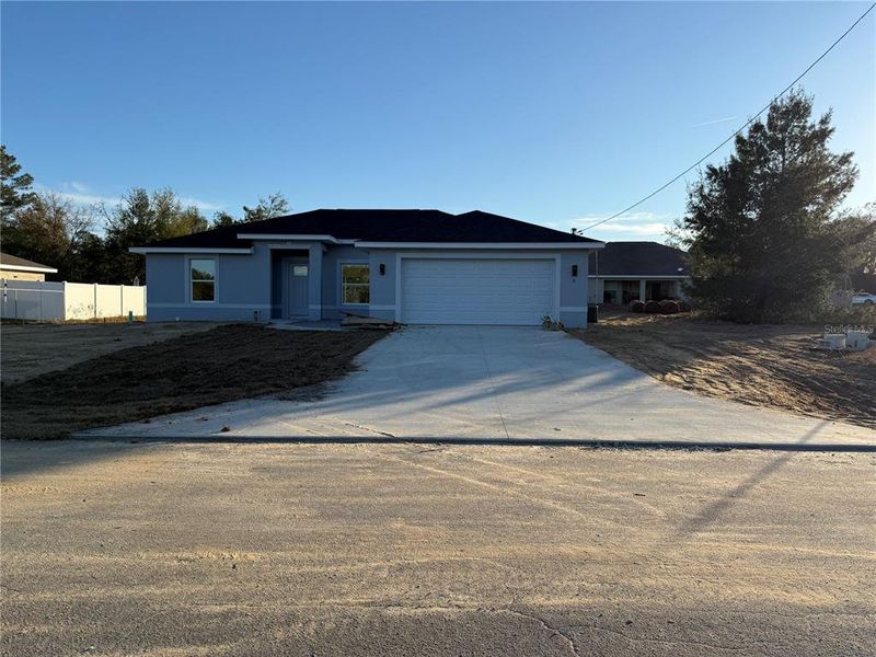 Front exterior of a new home in , Ocklawaha, FL, highlighting curb appeal (Image 1). Front exterior of a new home in , Ocklawaha, FL, highlighting curb appeal (Image 1).
