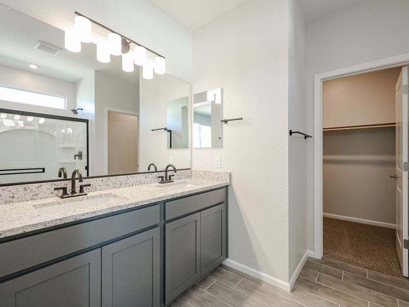 A bathroom with a large mirror. A bathroom with a large mirror.