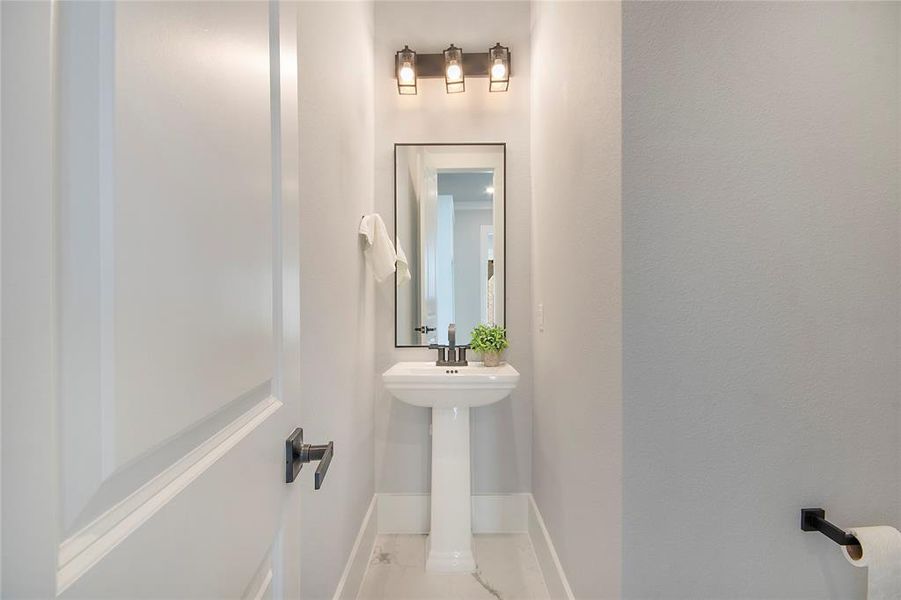 Bathroom featuring baseboards Bathroom featuring baseboards