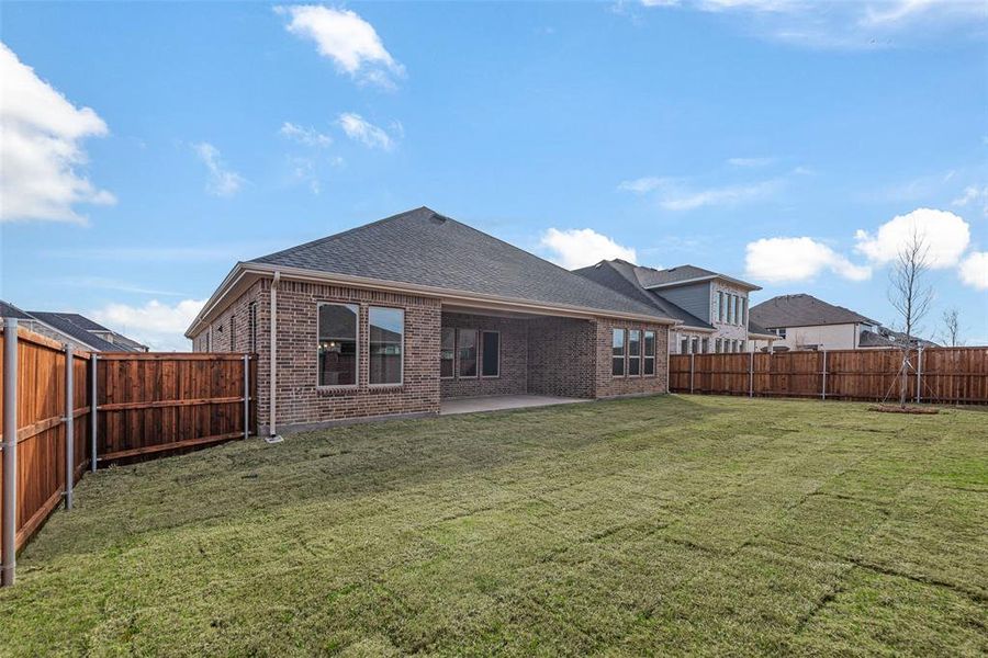 Exterior details and patio area of a home in Villages of Creekwood, Frisco (Image 4).