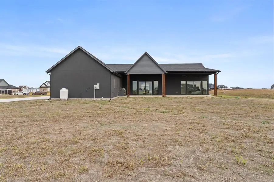 Exterior details and patio area of a home in , Venus (Image 4).