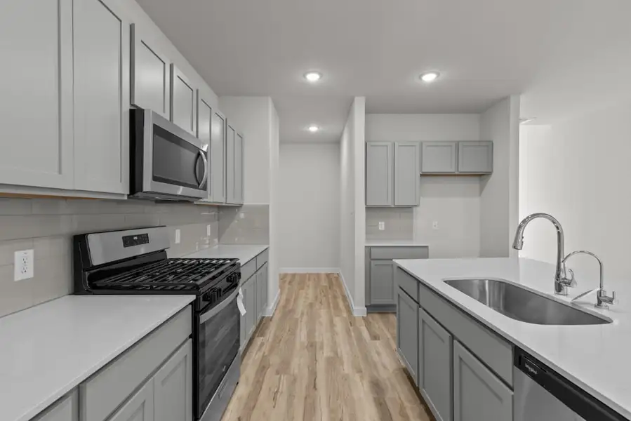 A kitchen with white cabinets. A kitchen with white cabinets.