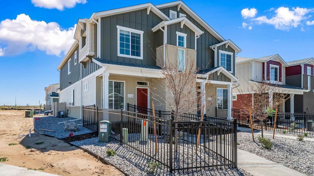 Front exterior of a new home in Green Valley Ranch, Aurora, CO, highlighting curb appeal (Image 2). Front exterior of a new home in Green Valley Ranch, Aurora, CO, highlighting curb appeal (Image 2).