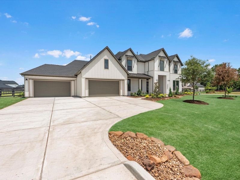 Front exterior of a new home in The Estates at James Lane, Fulshear, TX, highlighting curb appeal (Image 16). Front exterior of a new home in The Estates at James Lane, Fulshear, TX, highlighting curb appeal (Image 16).