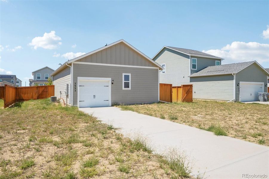 Front exterior of a new home in Wolf Creek Run, Strasburg, CO, highlighting curb appeal (Image 1). Front exterior of a new home in Wolf Creek Run, Strasburg, CO, highlighting curb appeal (Image 1).