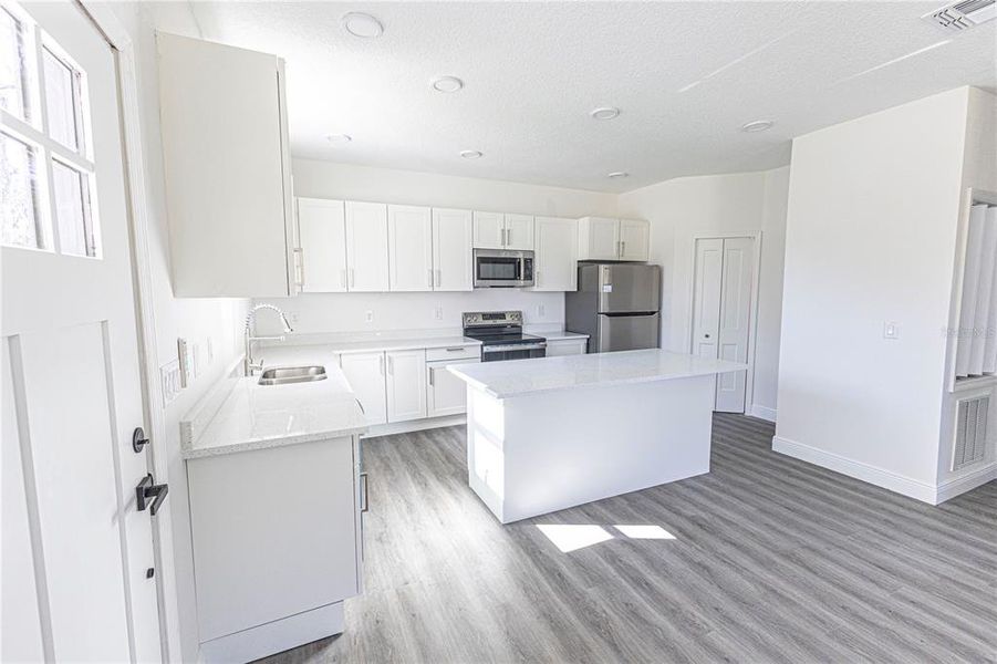Furnished interior view inside a new home in , Lake Panasoffkee (Image 6).