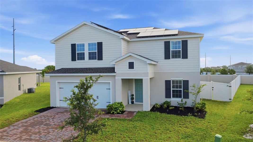 Front exterior of a new home in , Haines City, FL, highlighting curb appeal (Image 29). Front exterior of a new home in , Haines City, FL, highlighting curb appeal (Image 29).