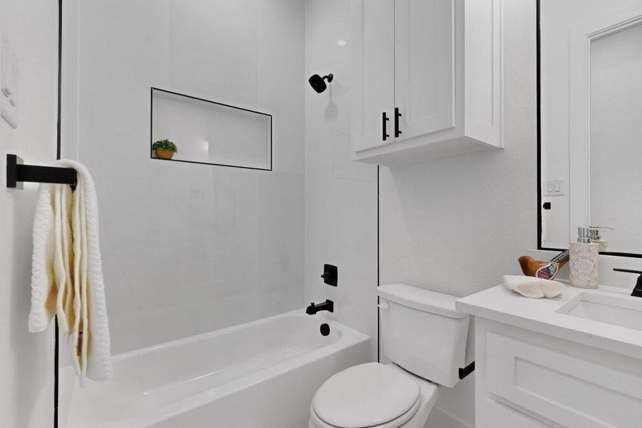 Full bath featuring washtub / shower combination and vanity Full bath featuring washtub / shower combination and vanity