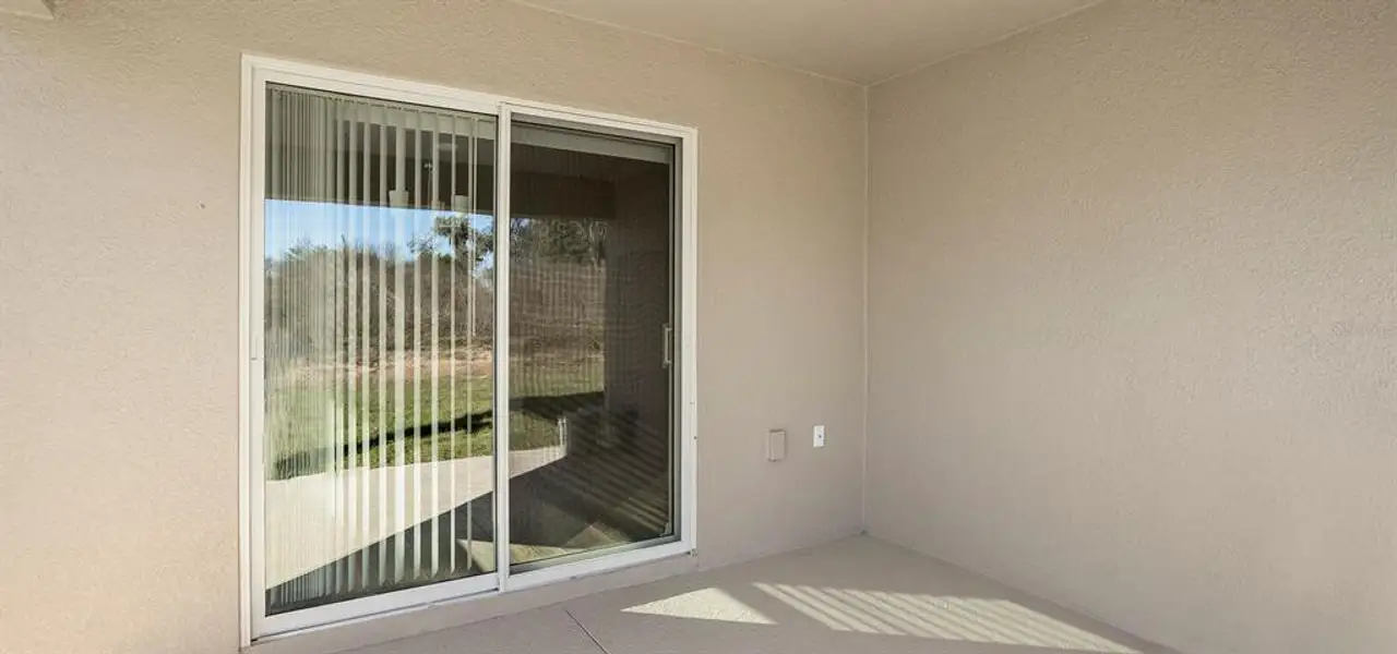 Exterior details and patio area of a home in Bennah Oaks, Belleview (Image 2).