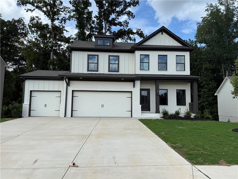 Front exterior of a new home in Rosewood Lake Estates, Hoschton, GA, highlighting curb appeal (Image 13).