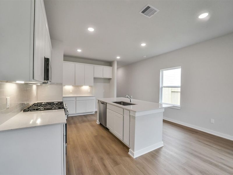 Furnished interior view inside a new home in Caney Creek Place, Conroe (Image 8).