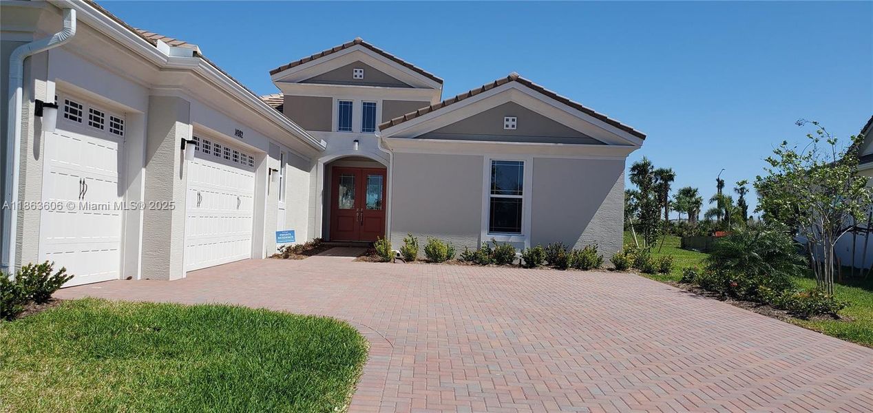 Front exterior of a new home in , Westlake, FL, highlighting curb appeal (Image 2).