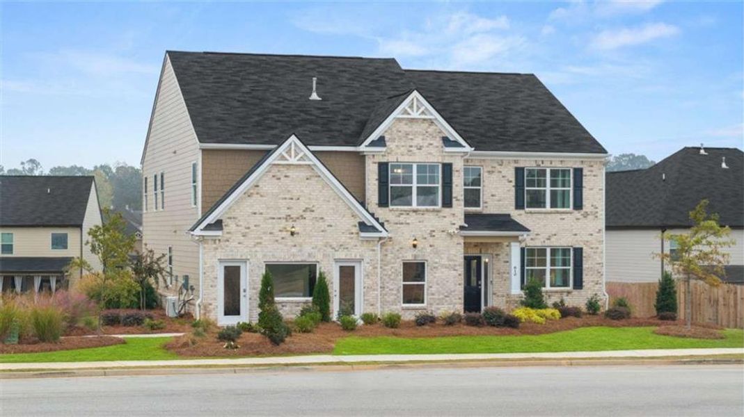 Front exterior of a new home in The Gates at Pates Creek, Hampton, GA, highlighting curb appeal (Image 2).