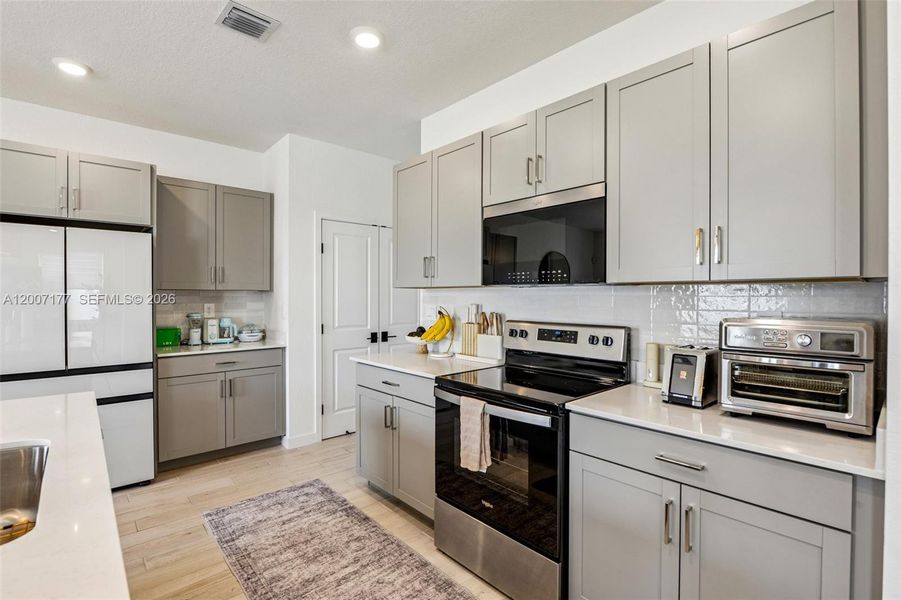 Furnished interior view inside a new home in Messina Place, Homestead (Image 8).