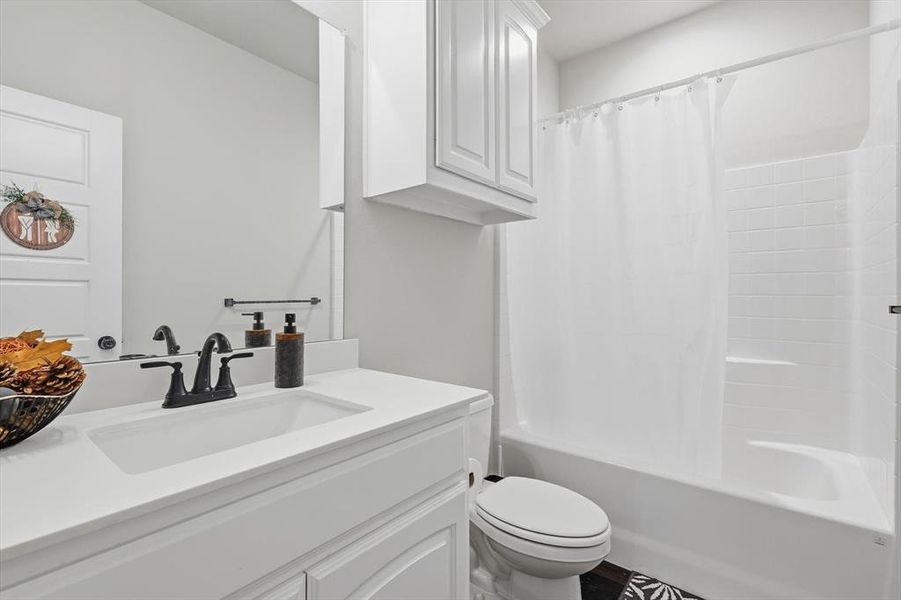 Bathroom with vanity and shower / bath combo