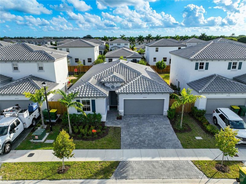 Front exterior of a new home in , Homestead, FL, highlighting curb appeal (Image 27). Front exterior of a new home in , Homestead, FL, highlighting curb appeal (Image 27).