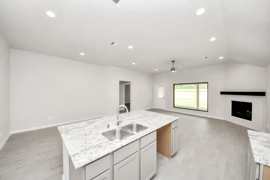 The extended counter area adds both practicality and style, making meal preparation a breeze. Every detail is thoughtfully designed to enhance the kitchen's functionality and aesthetic appeal. Sample photo of completed home with similar floor plan. Actual colors and selections may vary. The extended counter area adds both practicality and style, making meal preparation a breeze. Every detail is thoughtfully designed to enhance the kitchen's functionality and aesthetic appeal. Sample photo of completed home with similar floor plan. Actual colors and selections may vary.