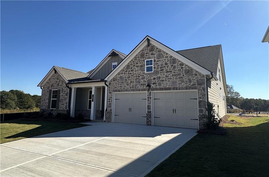 Front exterior of a new home in Summerlin, Winder, GA, highlighting curb appeal (Image 35).
