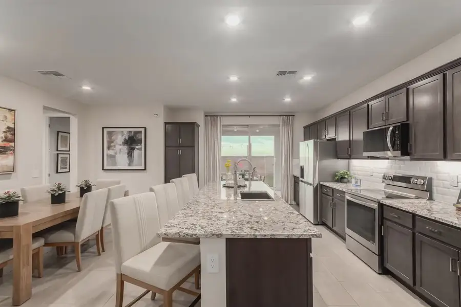 Furnished interior view inside a new home in Avanti at Granite Vista, Waddell (Image 9).