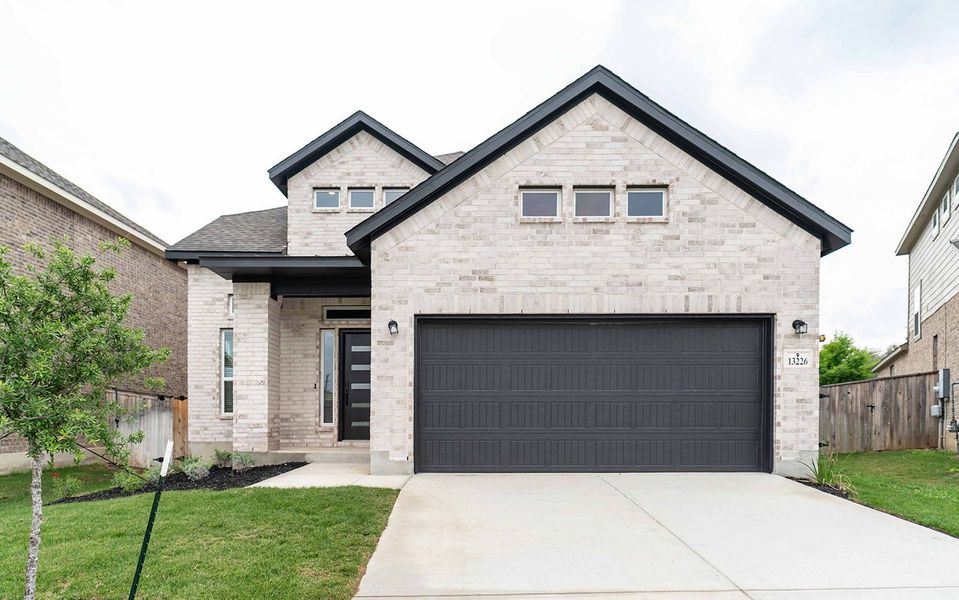 Front exterior of a new home in Arcadia Ridge, San Antonio, TX, highlighting curb appeal (Image 2).