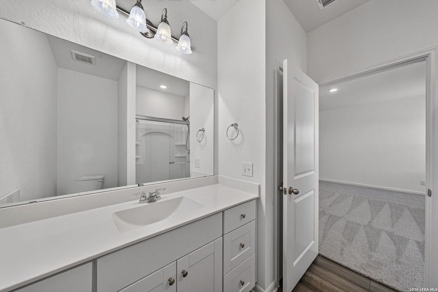 Furnished interior view inside a new home in Hennersby Hollow, San Antonio (Image 8).