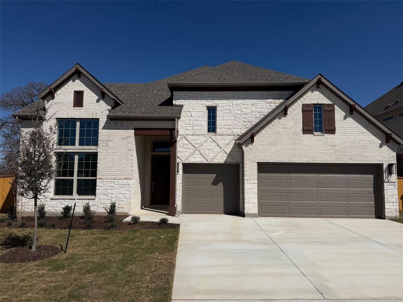 Front exterior of a new home in Oaks at San Gabriel, Georgetown, TX, highlighting curb appeal (Image 16).