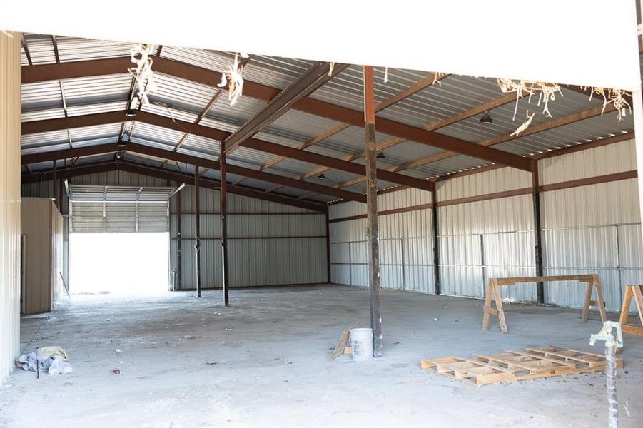 Garage featuring metal wall