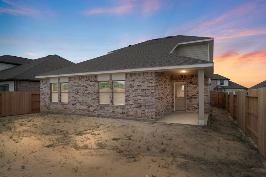 Front exterior of a new home in River Ranch Trails, Dayton, TX, highlighting curb appeal (Image 14).