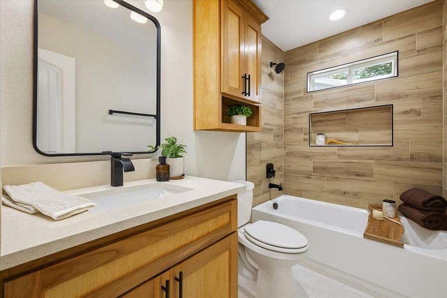 Full bath with shower / bathtub combination and vanity