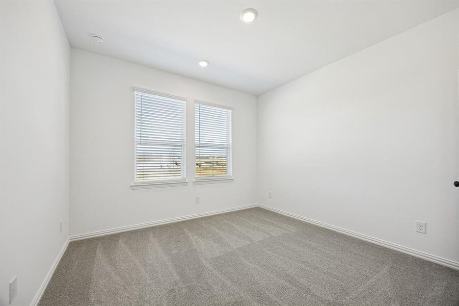 You'll find a nicely sized secondary bedroom in our Hansen floor plan.