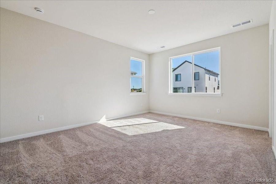 Spacious, unfurnished interior of a new home in Floret Collection at Alder Creek, Parker (Image 24).