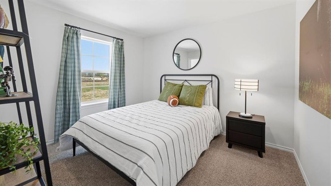 Carpeted bedroom featuring baseboards Carpeted bedroom featuring baseboards