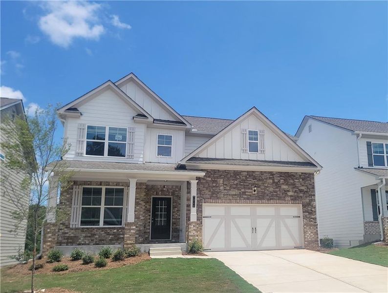 Front exterior of a new home in Clark Farms, Flowery Branch, GA, highlighting curb appeal (Image 1). Front exterior of a new home in Clark Farms, Flowery Branch, GA, highlighting curb appeal (Image 1).