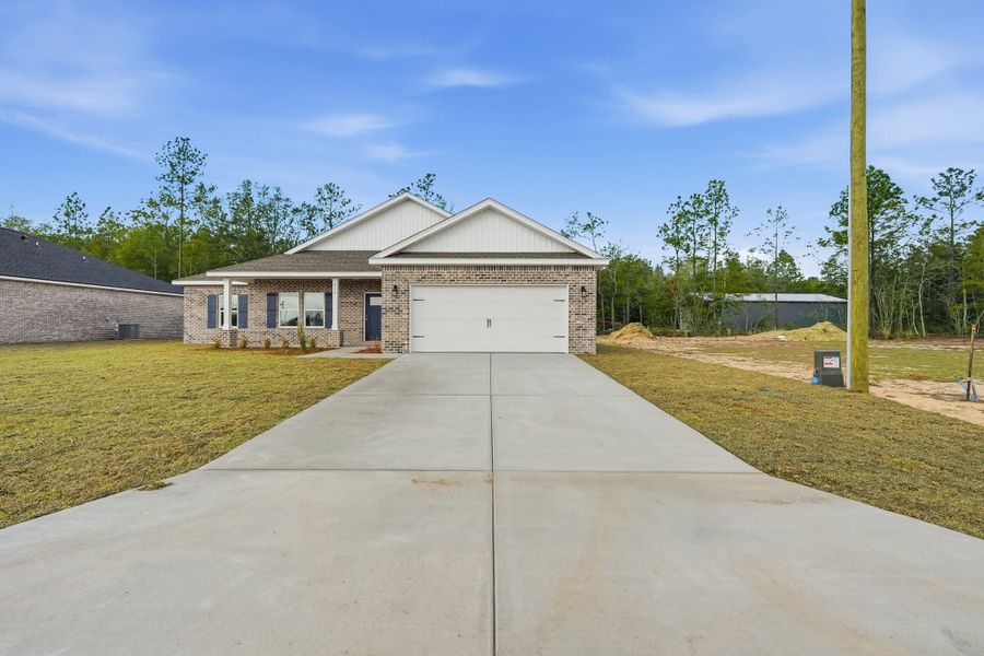 Front exterior of a new home in Southern Charm, Crestview, FL, highlighting curb appeal (Image 21).