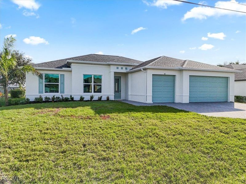 Front exterior of a new home in Cape Coral, Cape Coral, FL, highlighting curb appeal (Image 1).