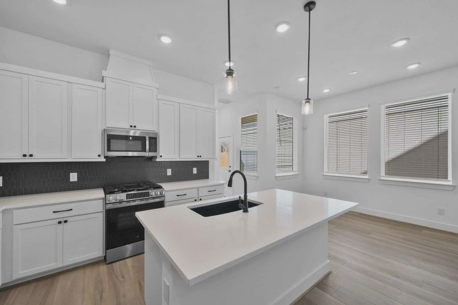 Representative furnished interior of a home built from the Versailles by Chesmar Homes in Meridiana Chateau, Manvel (Image 7).