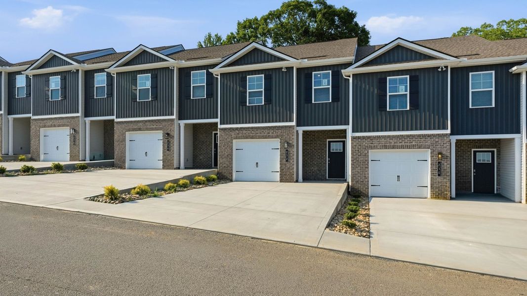 Front exterior of a new home in Macon Townhomes, Seymour, TN, highlighting curb appeal (Image 2). Front exterior of a new home in Macon Townhomes, Seymour, TN, highlighting curb appeal (Image 2).