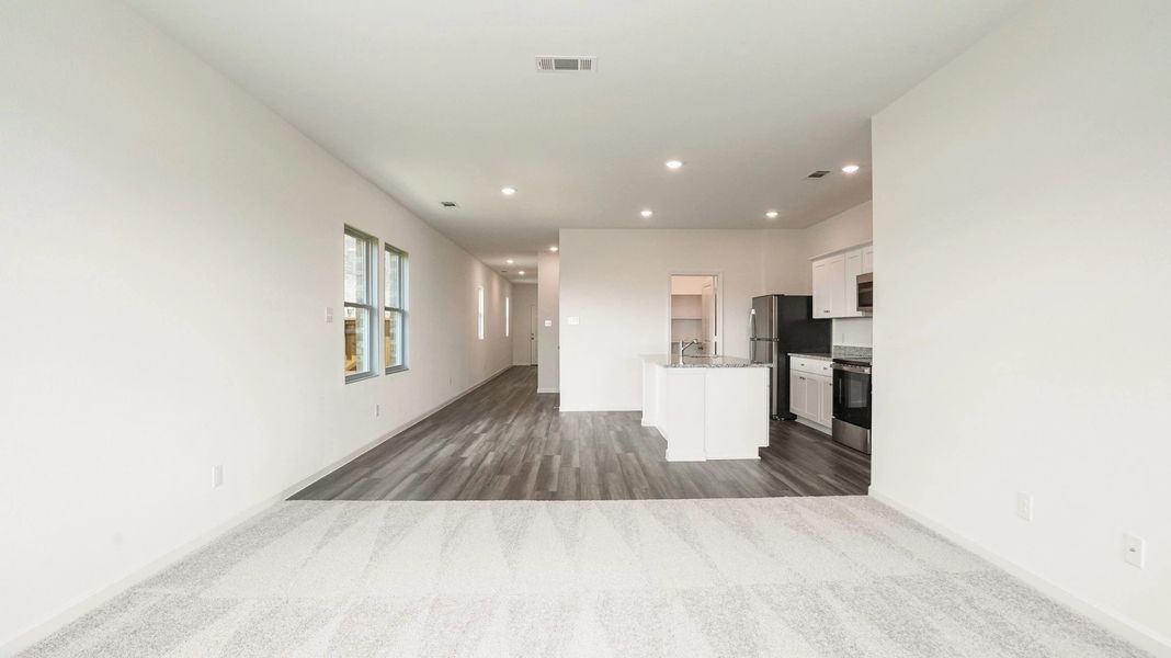 Representative unfurnished interior of a home built from the Athena by Starlight Homes in Creekview Fossil Ridge, Pilot Point (Image 15).