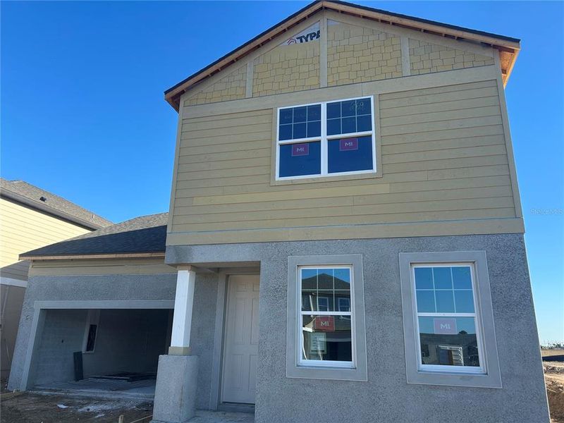 In-progress construction of a new home in Oakfield Trails Signature, Parrish, FL (Image 20).