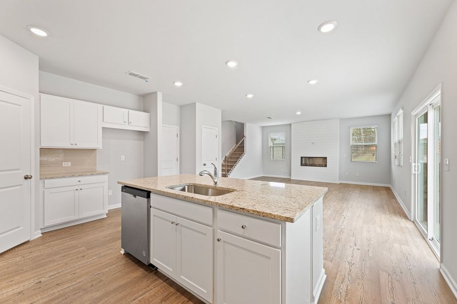 A kitchen with white cabinets. A kitchen with white cabinets.