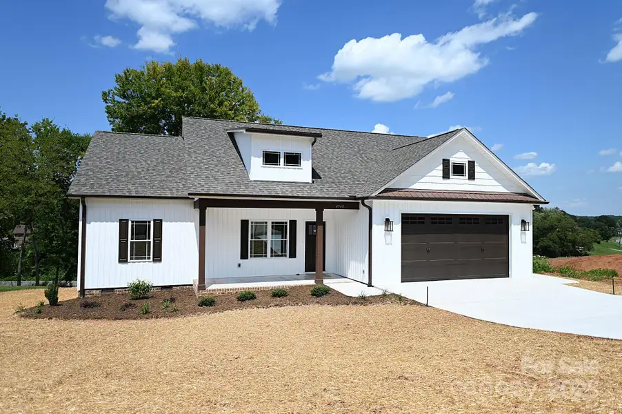 Front exterior of a new home in , Hickory, NC, highlighting curb appeal (Image 1).