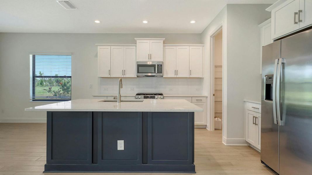 Furnished interior view inside a new home in Palm Grove Real Estate and Homes for Sale in Lakewood Ranch, FL - Neal Communities, Lakewood Ranch (Image 10).