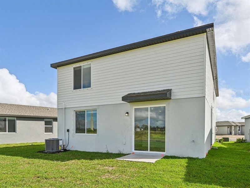 Exterior details and patio area of a home in Oakfield Trails - Signature Series, Parrish (Image 26).