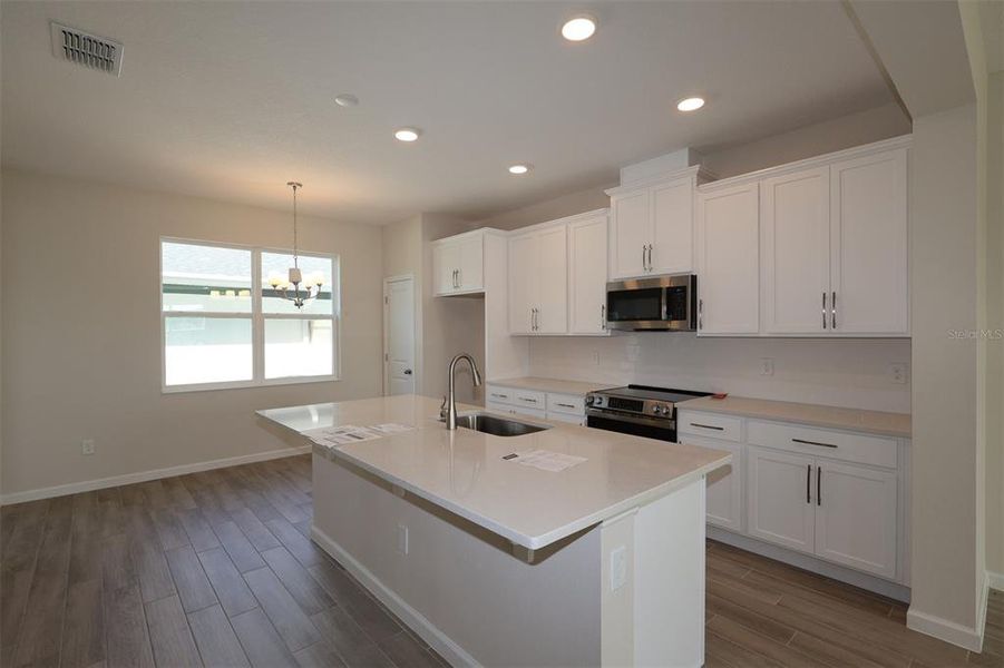Furnished interior view inside a new home in Center Lake on the Park, St. Cloud (Image 9).