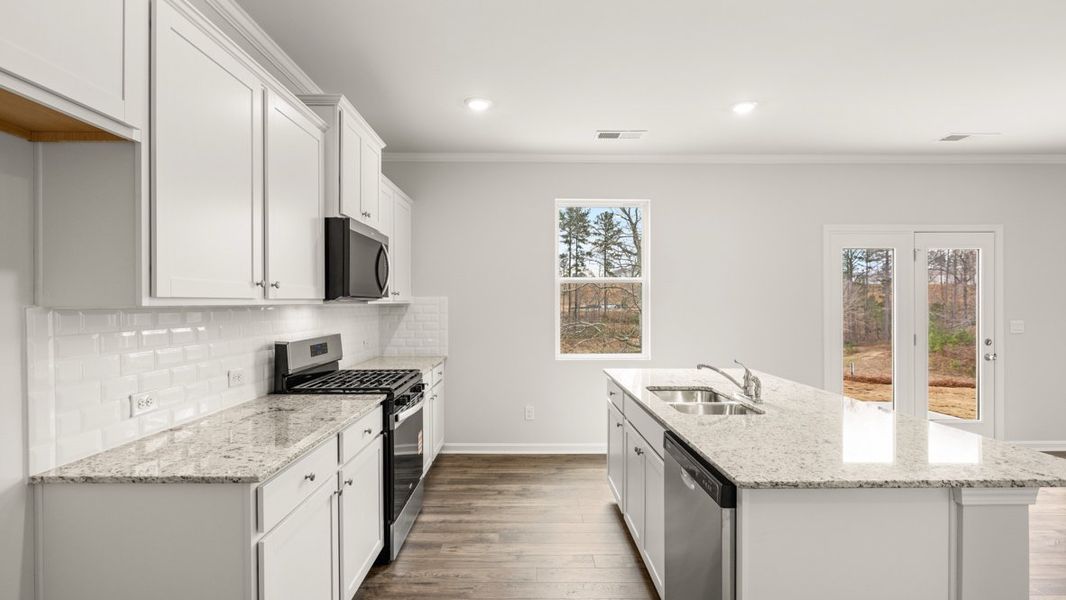 Representative furnished interior of a home built from the Galen by D.R. Horton in Thompson Ridge, Dallas (Image 6).