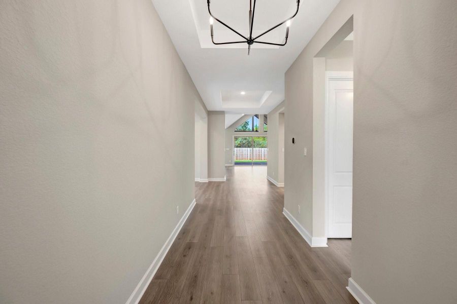 You will be WOW'd from the front door with t he high ceilings, wide Entry hall and view all the way through the 15 ft wide sliding glass doors - bringing the outside in!
